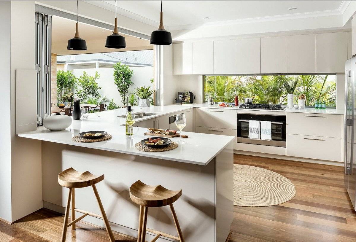 Кухонный остров с обеденным столом, барной стойкой и системой хранения в частном доме: варианты оформления в современном стиле
 - 26 фото